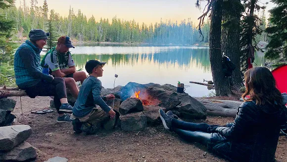 Family enjoying a camping adventure in nature